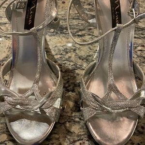 Nina - strappy silver heels - size 37 1/2. See pics for wear and tear
